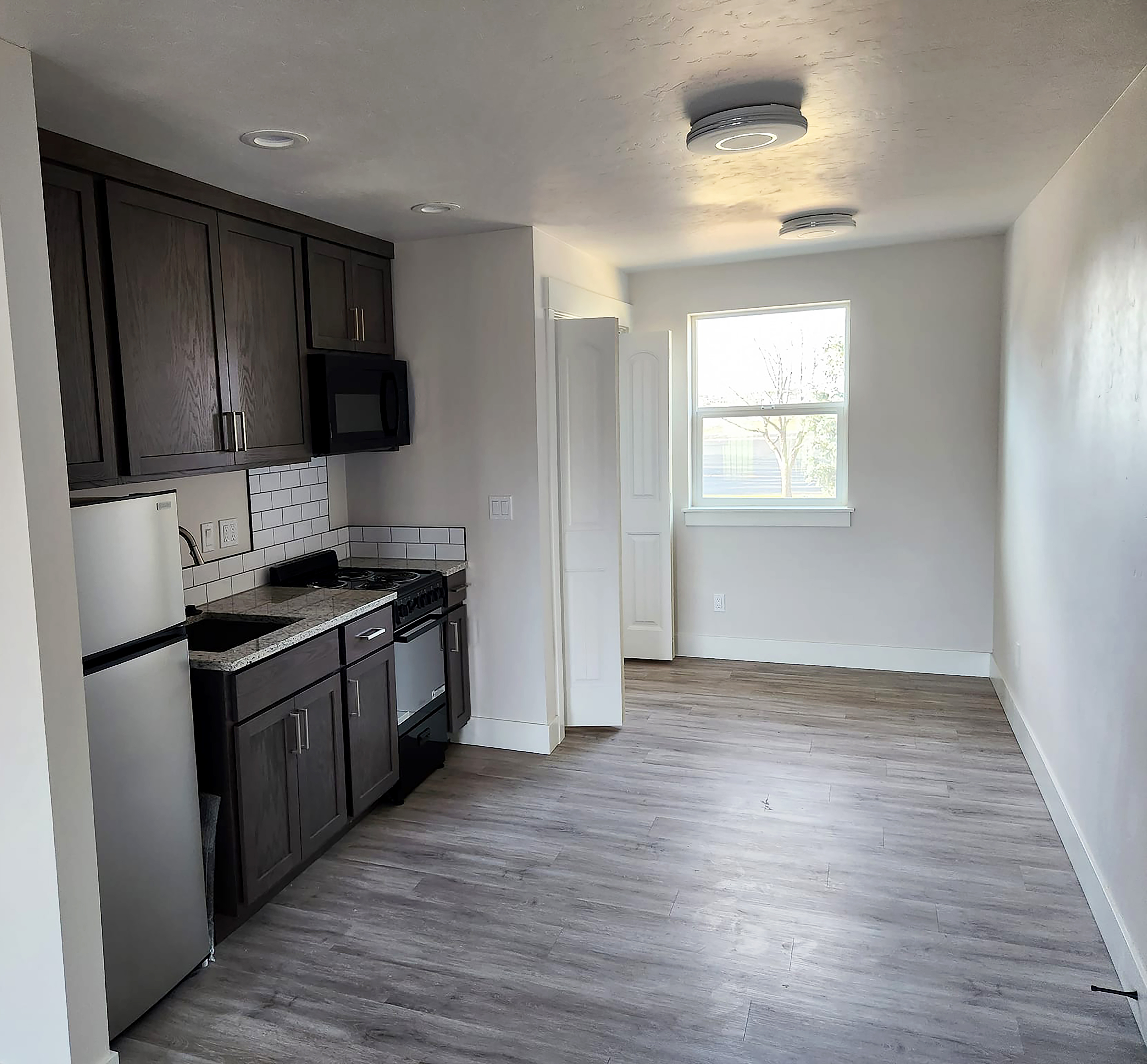 Custom kitchen with island and hardwood floors